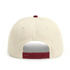 Chèvre sur le chapeau vert