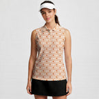 Lone Spur women's sleeveless golf shirt in Orange on a golfer, front view