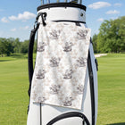 Jesus Riding Dinosaur Golf Towel - Hanging on a Golf Bag