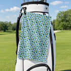 The Avocado Jump Golf Towel - Hanging on a Golf Bag