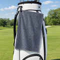 The Scattered Whales Golf Towel - Hanging on a Golf Bag